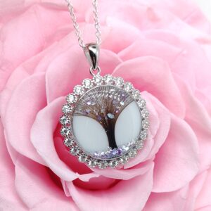 Bijou Voyage lacté artisanal en lait maternel résiné blanc sur fond blanc